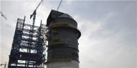 錫林郭勒熱電項目部脫硫收塔頂升制作到頂